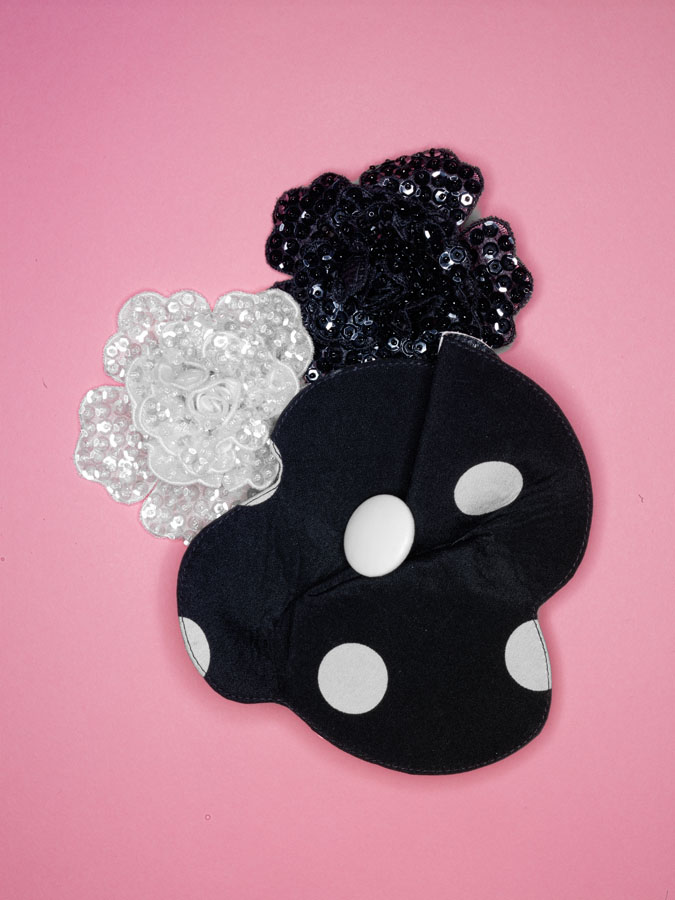Geoffrey Beeene pins with printed silk silk organza with white button, and sequined organza flowers.