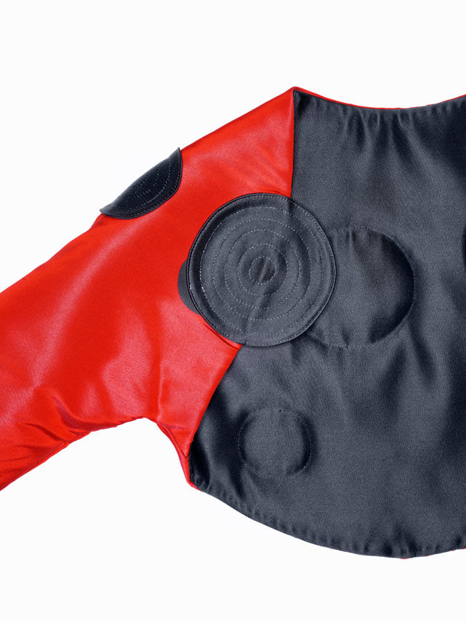 Geoffrey Beene satin shrug appliquéd with quilted bulls-eyes