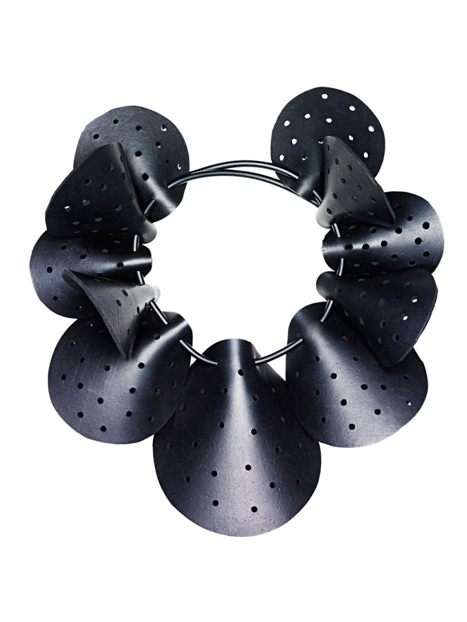 Geoffrey Beene ruff of perforated neoprene disks strung on rubber tubing