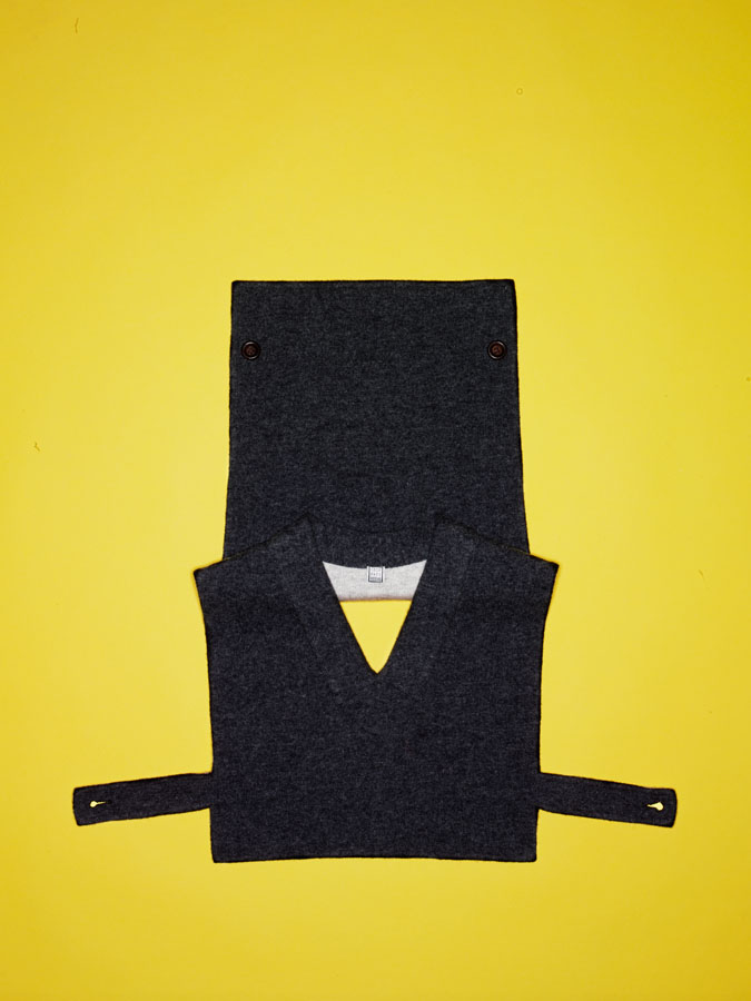 Geoffrey Beene gray wool vest with side strap and button detail.
